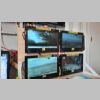 Quad TV sets, DVRs behind board.jpg